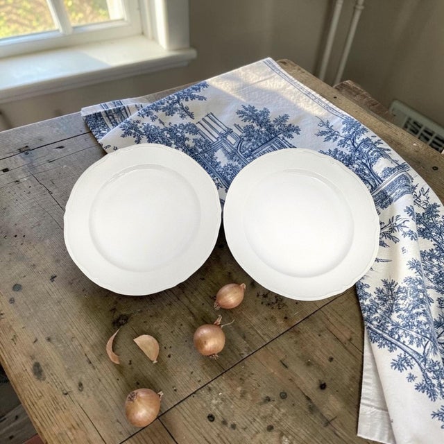 A matched set of eight late twentieth-century Limoges porcelain dinner plates, produced in Limoges, France. Each...