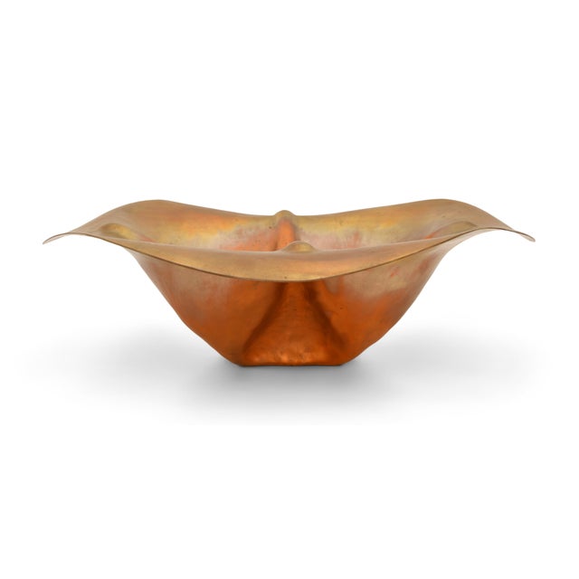 A striking hand-raised copper bowl by American metalsmith Thomas Roy Markusen, celebrated for his fluid, organic forms...