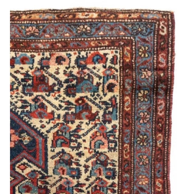 This is a lovely hand knotted antique ivory navy blue Persian Malayer rug from the 1900-1910s measuring 3.3 x 6 ft....