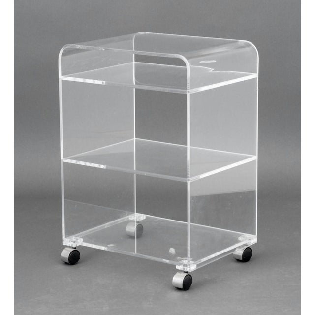 Modern Clear Acrylic "Waterfall" Rolling Bar Cart, with three shelves on four casters. 30.25" H x 20.5" W x 16" D....