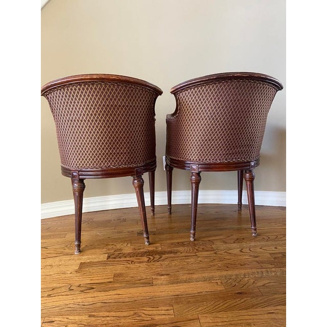 Beautiful pair of Louis XVI Bergere barrel back chairs! Dimensions: 35.25” tall 23” wide 20” deep