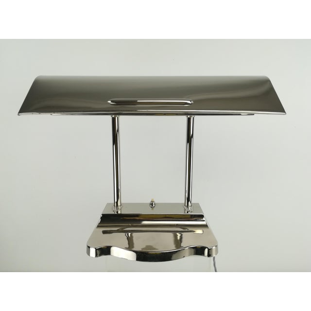 Very elegant desk lamp with pen tray. Restored and rewired to meet current safety standards. The lamp provides a cozy,...