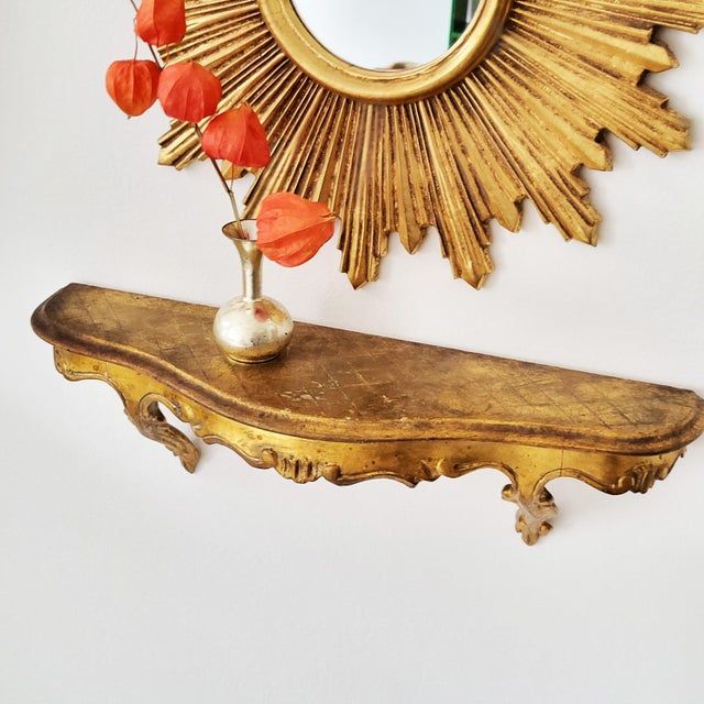 Lovely ornate mid-century gilded & intricately carved wooden console / hanging shelf with highly decorative cabriole legs....