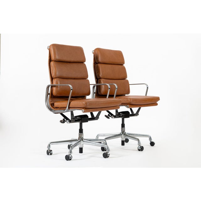 These authentic Eames for Herman Miller Soft Pad Executive Height office chairs from the Aluminum Group Collection were...