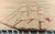 Sails of the Empire: A Full-Rigged Royal Navy Woolie Circa 1875 The vessel depicted in this sailor's woolwork is a full-...