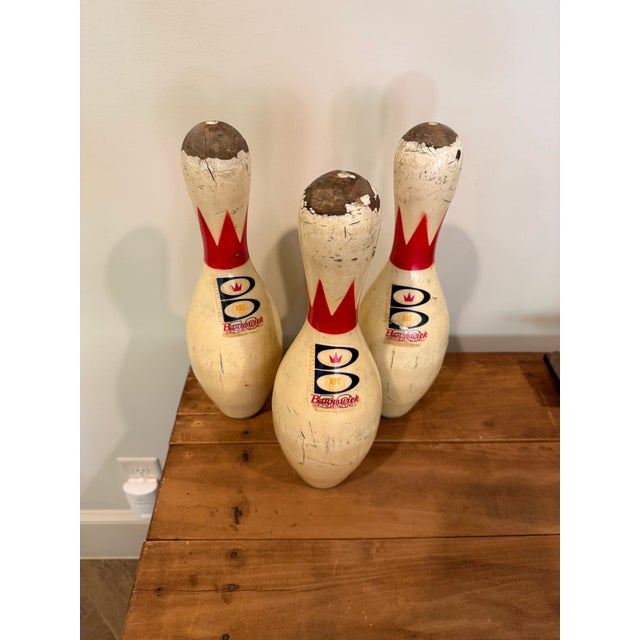 Bring authentic bowling alley nostalgia to your home with this set of three vintage Brunswick ABC bowling pins. Featuring...