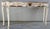 This is a beautiful hand-painted Italian console table with the base of white and silver gilt detail. The top has a trim...