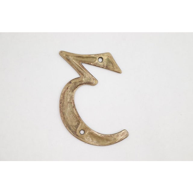 Solid polished brass house number 3 with two predrilled screw holes. The original mounting screws are not available. Good...