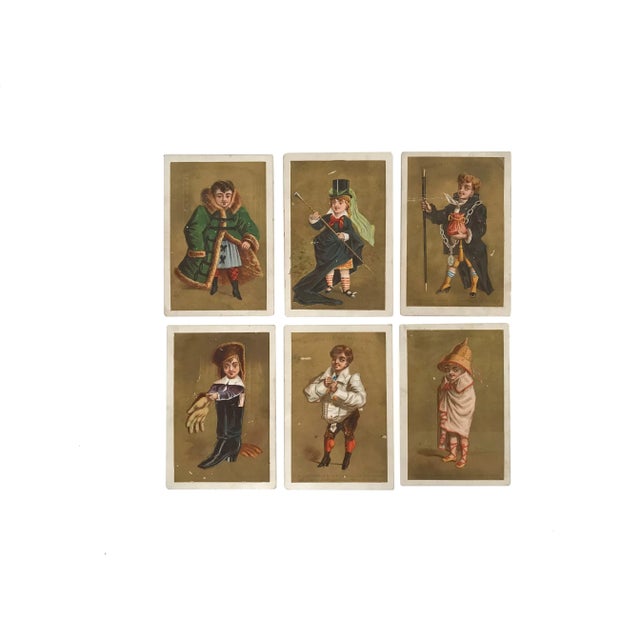 A set of six (6) vintage antique French chromolithograph publicity advertising trading cards by the clothing company...