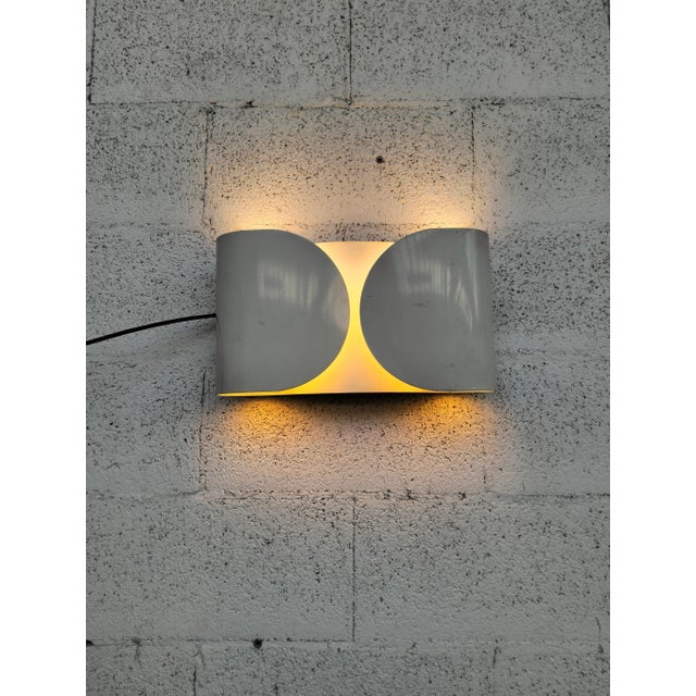 Flos - foglio, a historic piece from the flos catalog designed by tobia scarpa, is a wall lamp with direct/indirect and...