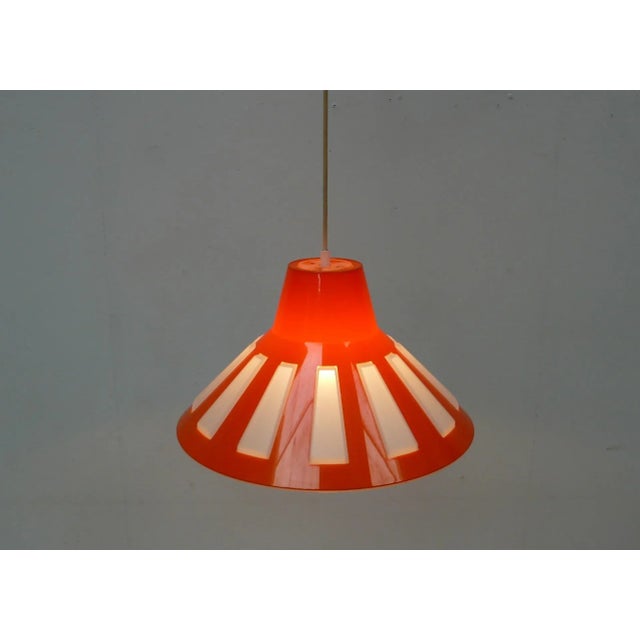 60s 70s ufo space age hanging lamp, conical cone shape in orange and white, plastic, typical 60s 70s mid century modern....