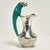 Standout vintage pitcher handcrafted in silver plate on hammered copper featuring a stone clad parrot as a handle....