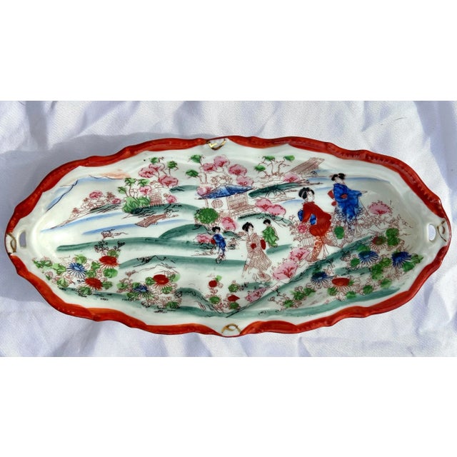 Offered is a wonderful set of twenty one (21) hand painted plates bowls and a moriage tray made in Japan circa 1920. These...
