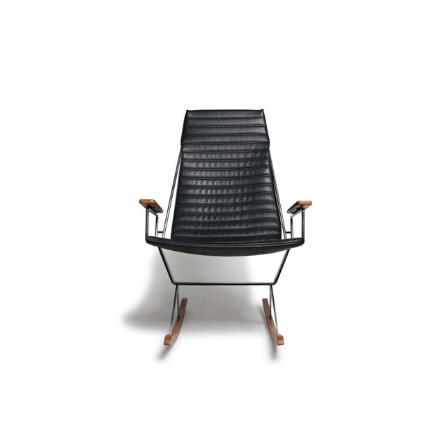 Rocking chair designed by California designer Gerald McCabe for Brown Saltman c.1960. The sling seat is upholstered in the...