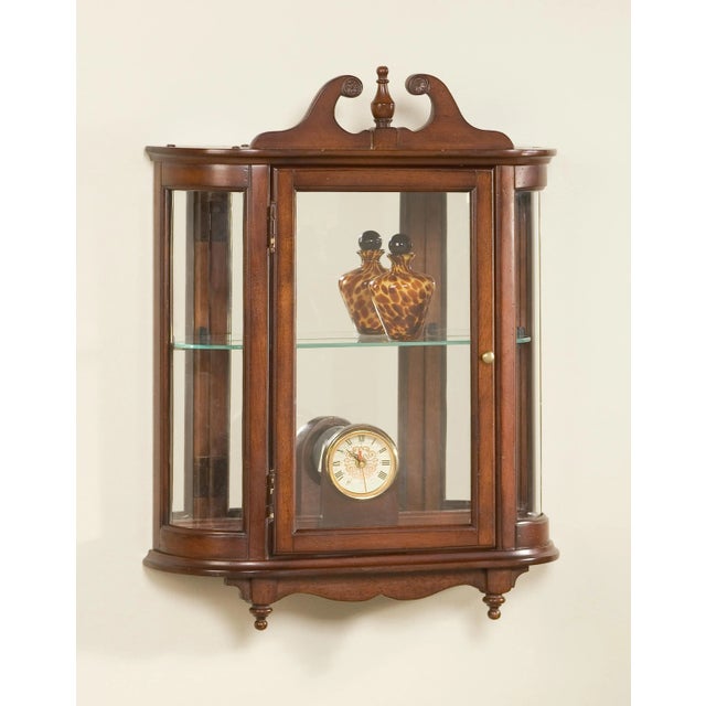 This distinctive wall curio is both functional and beautiful with two adjustable glass shelves and a mirrored back to...