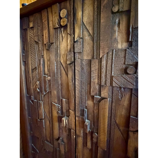 Mid-Century Modern wardrobe armoire and nightstand from the “Pueblo” line of Lane Furniture. Brutalist in style, the...