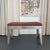 This custom bench seamlessly combines architectural poise with industrial sophistication for an impressive seating choice....