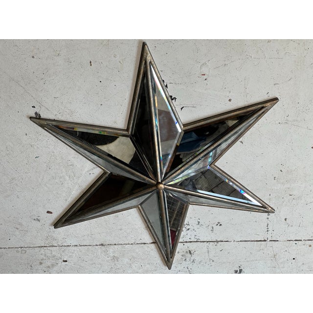 A stunning 28" beveled glass starburst with gorgeous light-catching facets — a true statement piece for any wall. Features...