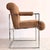 This Mid-Century Modern armchair attributed to Milo Baughman dates back to approximately 1976. This striking lounge chair...
