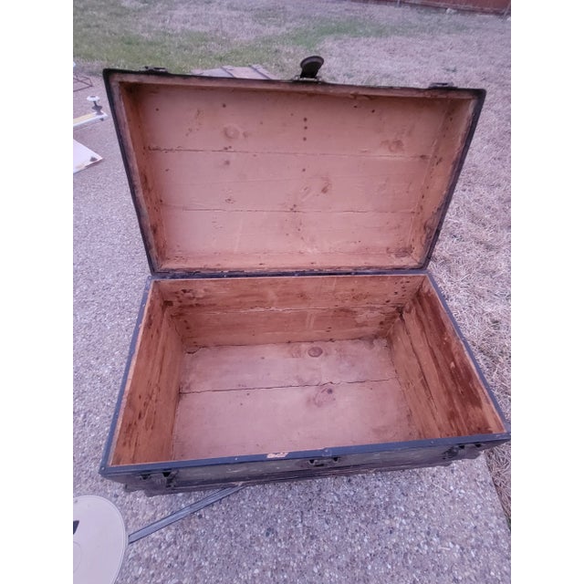 Unique Antique German Steamer Trunk with Semi Flat Top and a "K.M." Mark. Mainly made of wood with metal locks and hinges,...