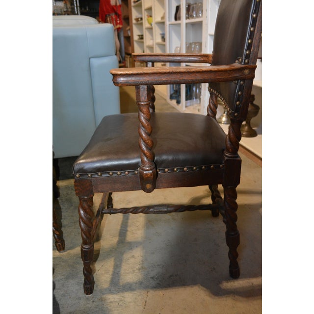 This is an amazing set of 6 dining chairs. 2 have arms. Oak barley twist with black leather upholstery (newer than the...