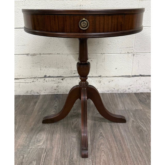 This is a beautiful vintage Imperial Furniture All Mahogany drum table featuring a round top, single dovetailed drawer,...