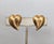 1982 goldtone ribbed heart clip and screw back earrings. Marked "NAPIER©" on the clips. Measure: 7/8 inches long by 3/4...