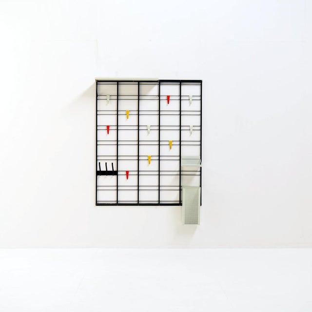 Take a look at this modernist coat rack. with its sleek, ladder-like silhouette (almost like a musical scale) and...