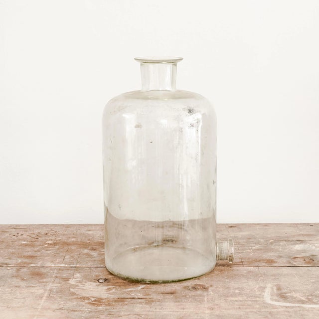 Large vintage lab glass vessel with flared lip top and dispenser spout.