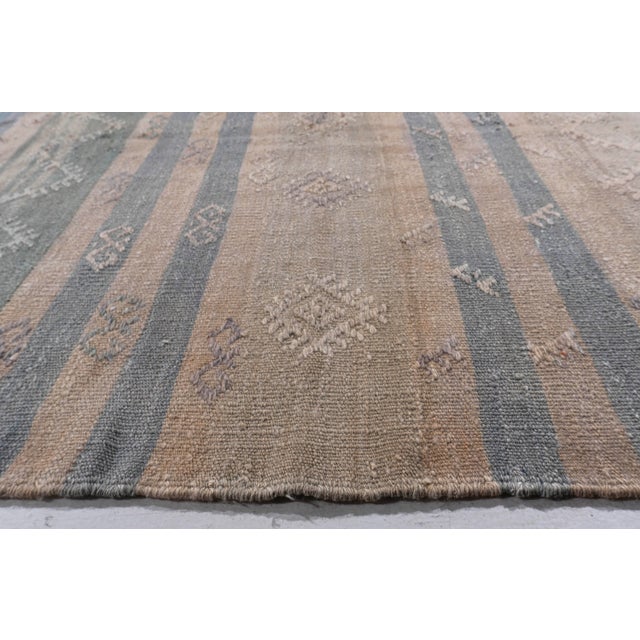 This vintage Turkish flat weave Kilim is hand-woven. The simplicity and boldness of this piece can also give a...