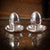 A 20th century italian solid silver pair of egg cups, retailed by asprey of london. Each egg cup features a removable lid,...