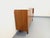 Vintage Scandinavian-style teak sideboard from the 1960s. Shallow design with ample storage: one open niche, two doors...