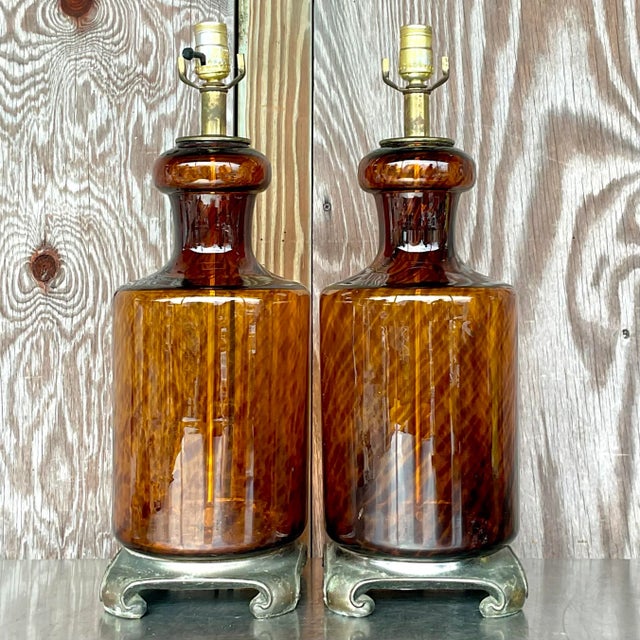 A fabulous pair of vintage Boho table lamps. Chic tortoise shell blown glass on a brass Ming plinth. Acquired from a Ft...