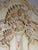Impressive decorative armoire featuring an elaborate baroque-inspired design with richly carved floral ornamentation...
