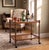 Striking English tea bar cart from the 1950s in oak, featuring beautifully twisted legs and an elegant glass top. A highly...