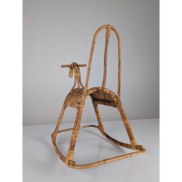 Mid-century bamboo and rattan rocking horse. A beautiful functional decorative complement for any play or children's room...