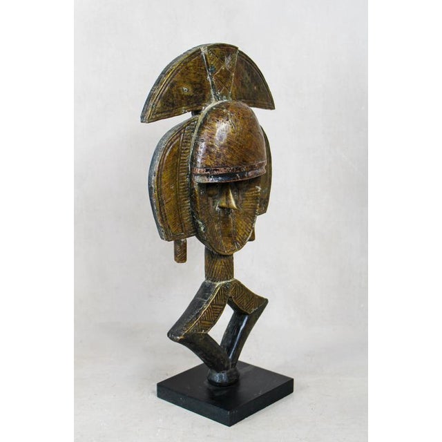 These figures are made by the kota people from mahingwe in gabon and used in ceremonies. Sculpted from wood the facial...