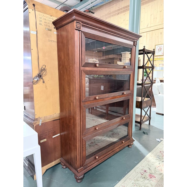 A distinguished vintage Ethan Allen barrister bookcase from the coveted British Classics collection, showcasing a rich...