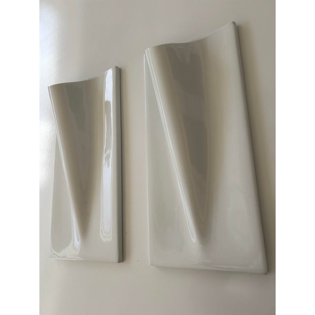 Pair of Arhaus large, white wall vases. Handcrafted of stoneware in a glossy finish. Put lights inside to create modern,...
