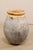 A French Biot jar from the early 20th century. This antique vessel from France features a mellow glazed and rolled rim &...