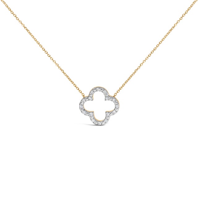 A whisper of luck and light, this open quatrefoil floats at your collarbone like a talisman, its airy outline traced with...