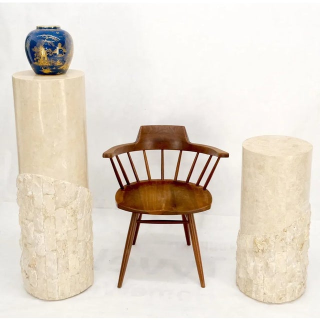 Pair of decorative mid century modern decor tessellated stone round pedestals. The short one is 29" tall.