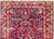 A wonderful early 20th century Persian Sarouk runner with an all-over mirrored floral pattern woven in traditional Sarouk...