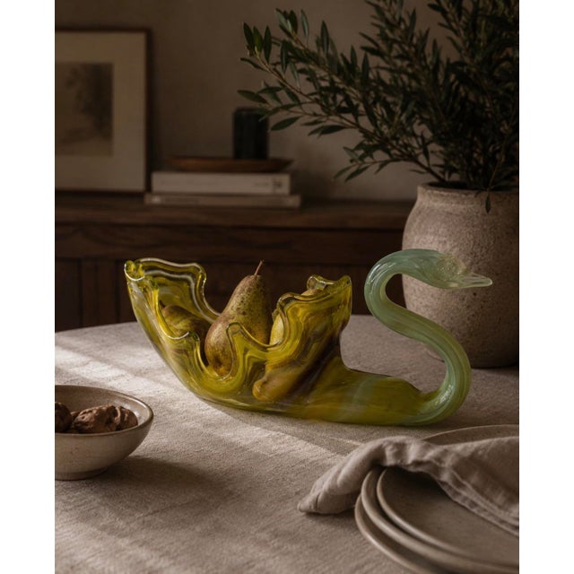 A hand blown art glass swan in vivid chartreuse to olive green with adolescent white marbling through the body. Beautiful,...