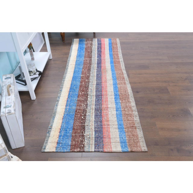 Vintage Turkish Hand-Knotted vintage rug is a semi-antique vintage kilim runner rug.'70s Eastern region of Turkey's unique...