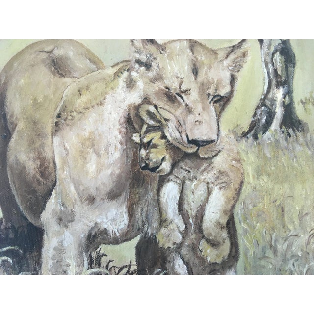 This lovely piece is an oil on canvas. It depicts a lioness with her cub.