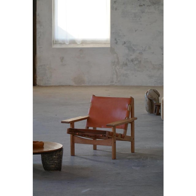 An exceptional pair of mid-century Hunting Chairs designed by Kurt Østervig for KP Møbler in the 1960s. Constructed from...