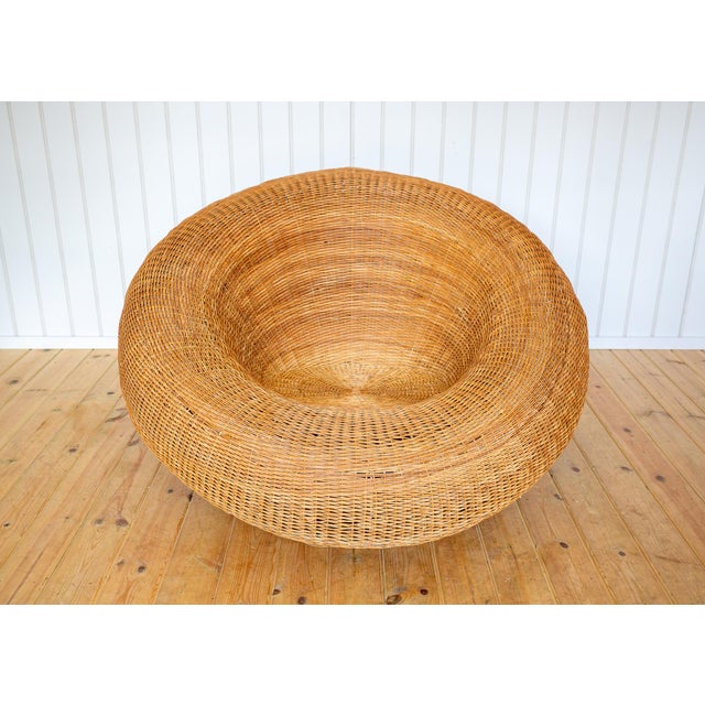 A rare and strikingly attractive oversize wicker basket armchair in lovely vintage condition. Crafted in the style of...