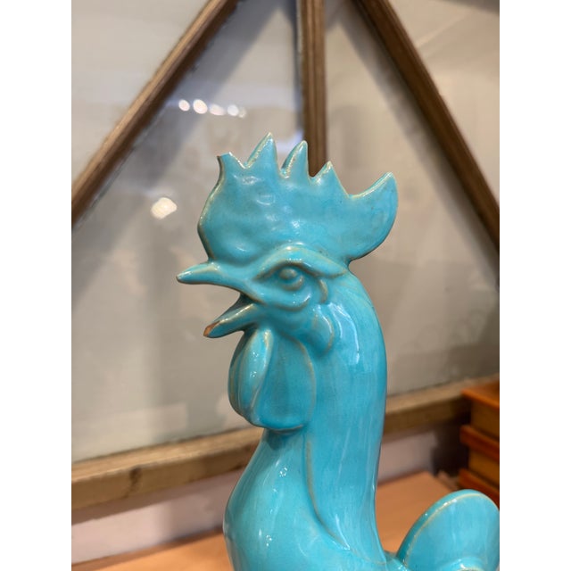Add a vibrant pop of color and character to your space with this vintage turquoise glazed ceramic rooster figurine. It...