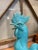 Add a vibrant pop of color and character to your space with this vintage turquoise glazed ceramic rooster figurine. It...